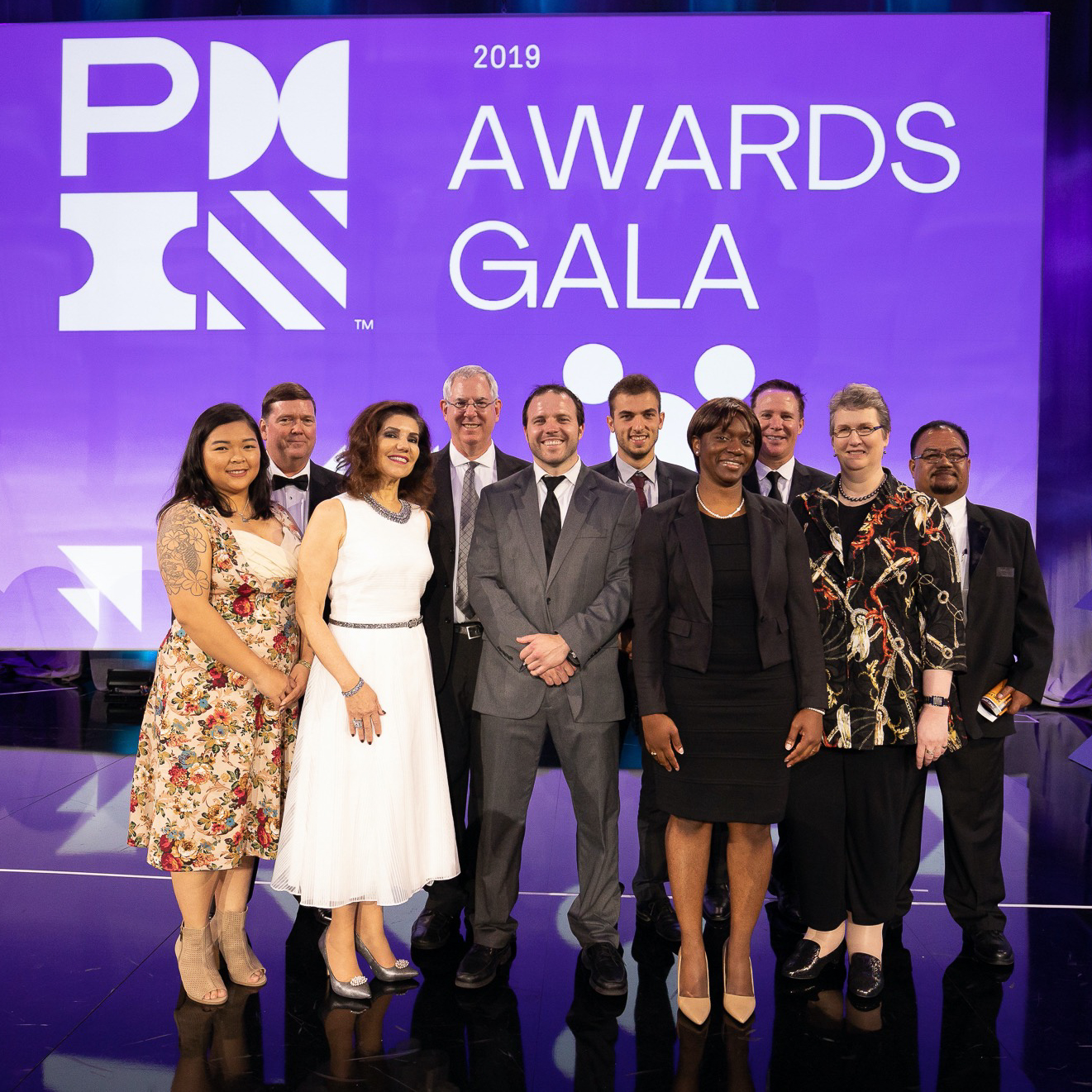 PMI award recipients on stage at gala event