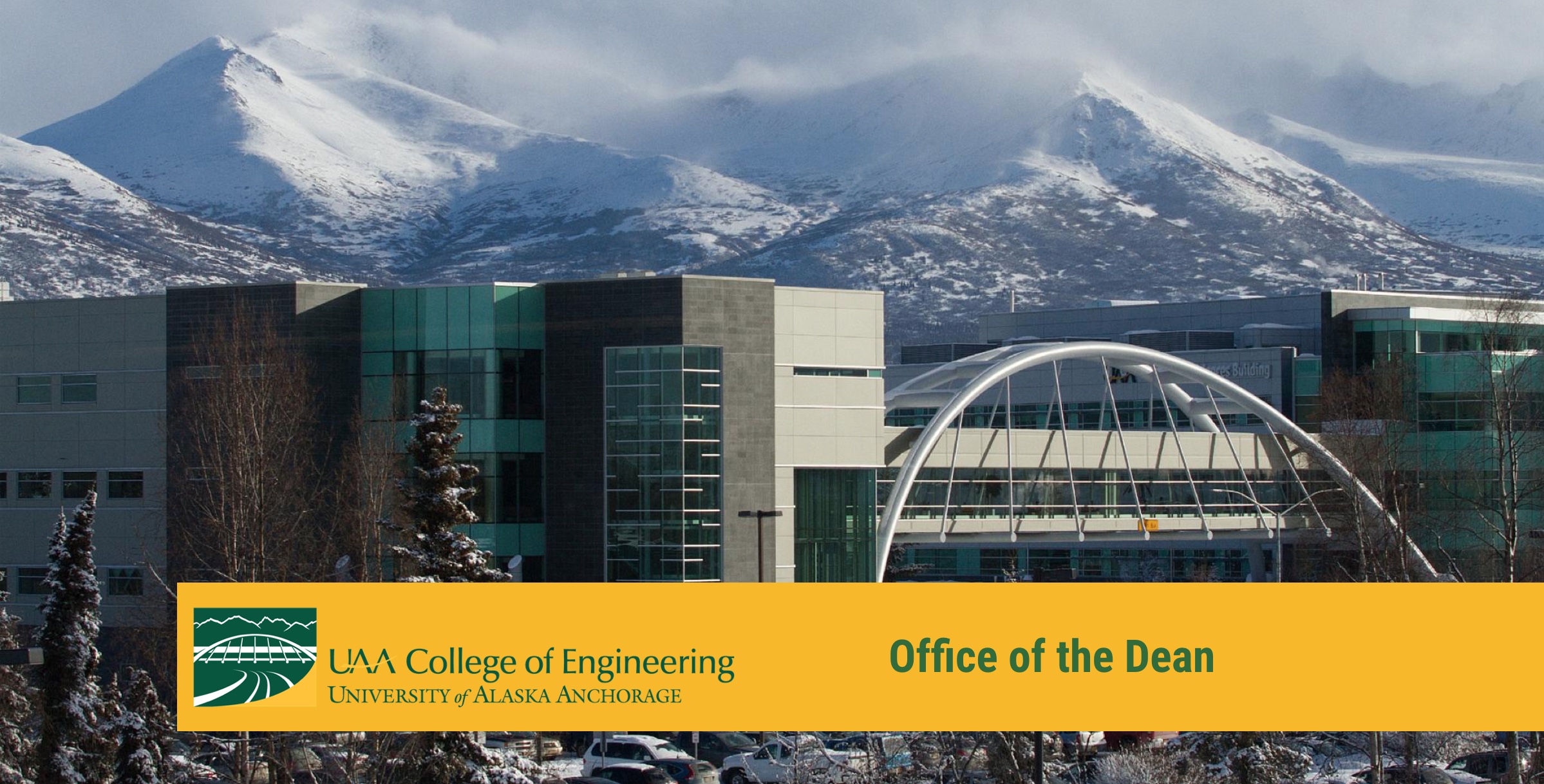 campus buildings with mountains in the background and header text for office of the dean