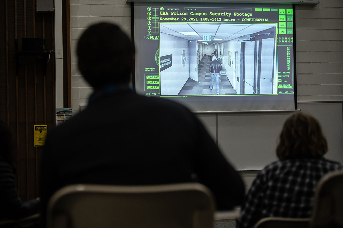 Criminal Investigation students observe surveillance footage as part of a mock crime scene investigation