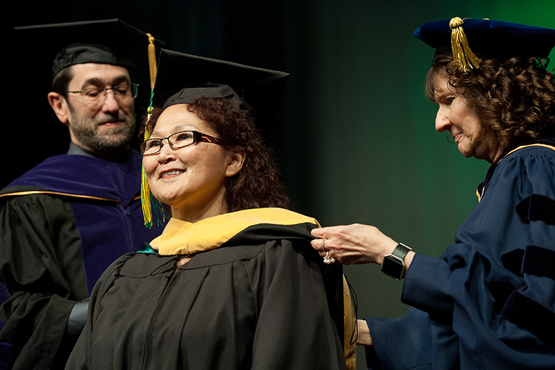 Lucy Apatiki, Master of Social Work, is hooded at UAA's Fall 2017 Graduate Degree Hooding Ceremony