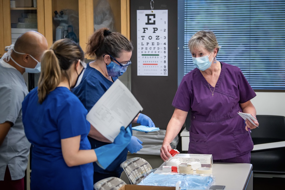 medical assisting faculty show students how to sterilize instruments
