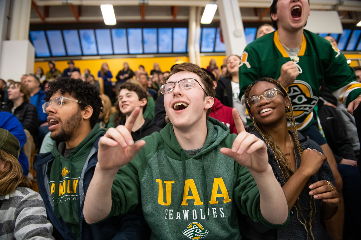 Fans cheering during Seawolf hockey game