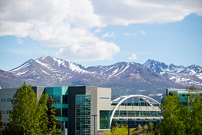 UAA Skybridge in foreground with Chugach Mountains behind.
