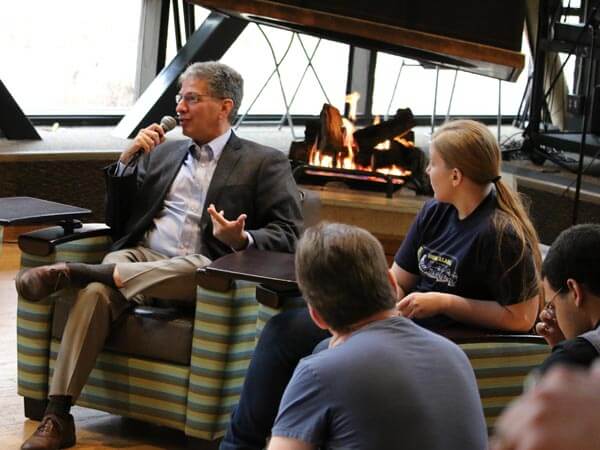 Mayor of Anchorage sits and talks with students in the Student Union Den