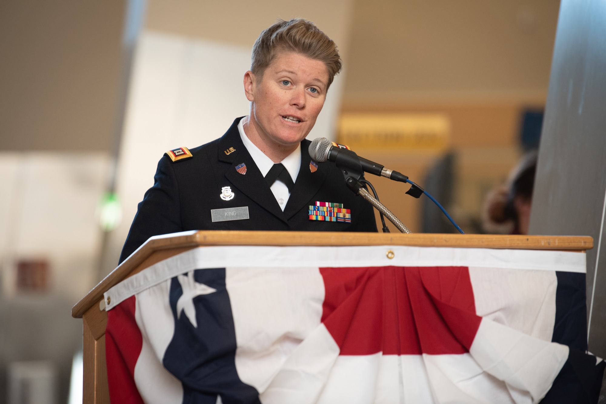 Alaska Army National Guard Capt. Jill King, M.B.A. General Management ’13, speaking at UAA’s Veterans Day Celebration in the Alaska Airlines Center on Nov. 11, 2019. (Photo by James Evans / University of Alaska Anchorage)