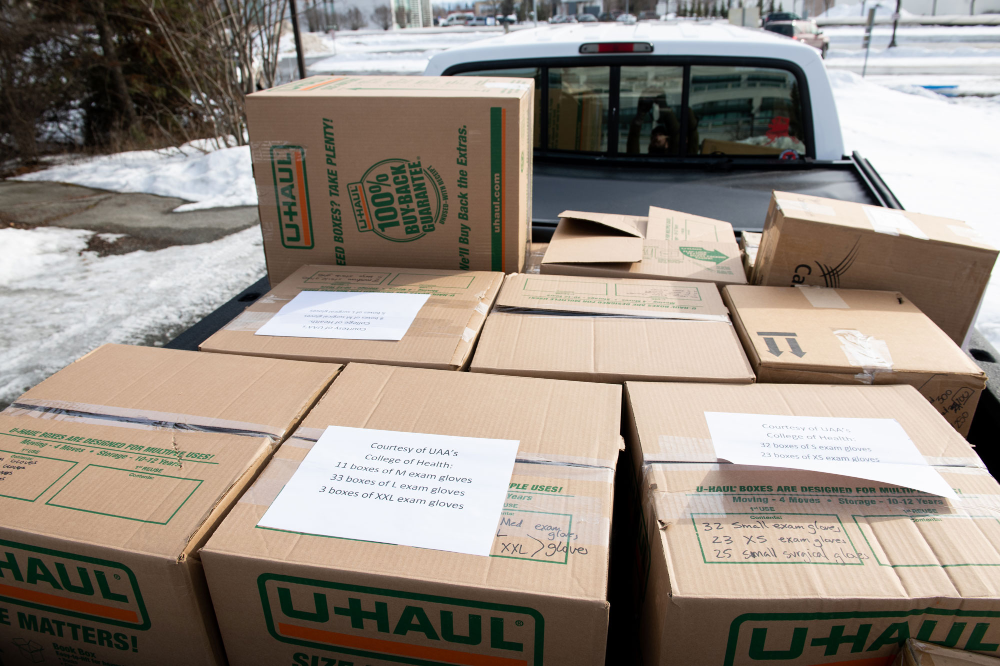 UAA PPE donation to DHSS loaded in the back of a pick-up truck