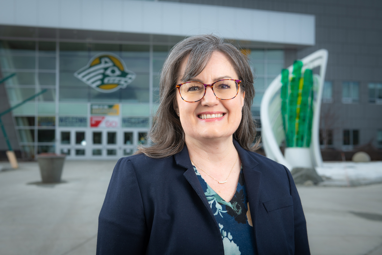 Teresa Novakovich poses in front of the UAA Alaska Airlines Center