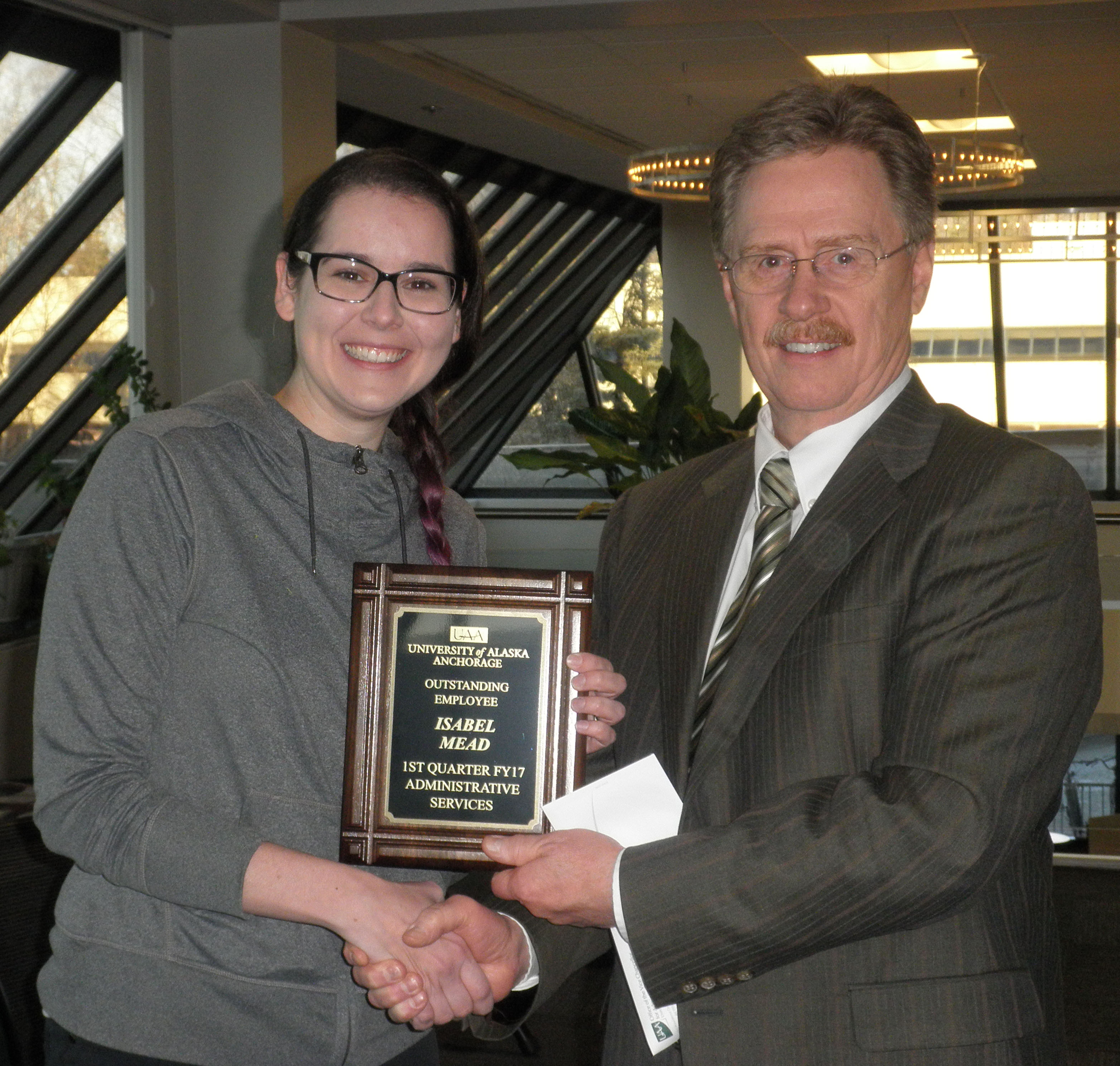 Isabel Mead receiving Employee of the 1st Quarter from Pat Shier FY17