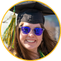 Graduate with cap and 2021 tassel and sunglassees on.