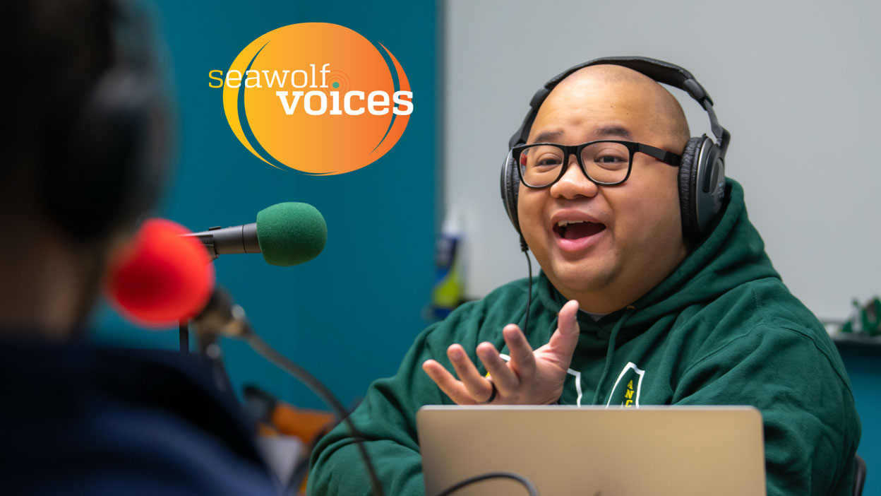 man talking into a microphone