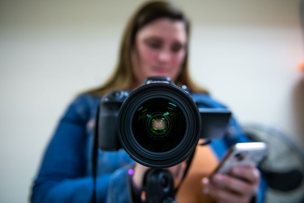 a person setting up a camera