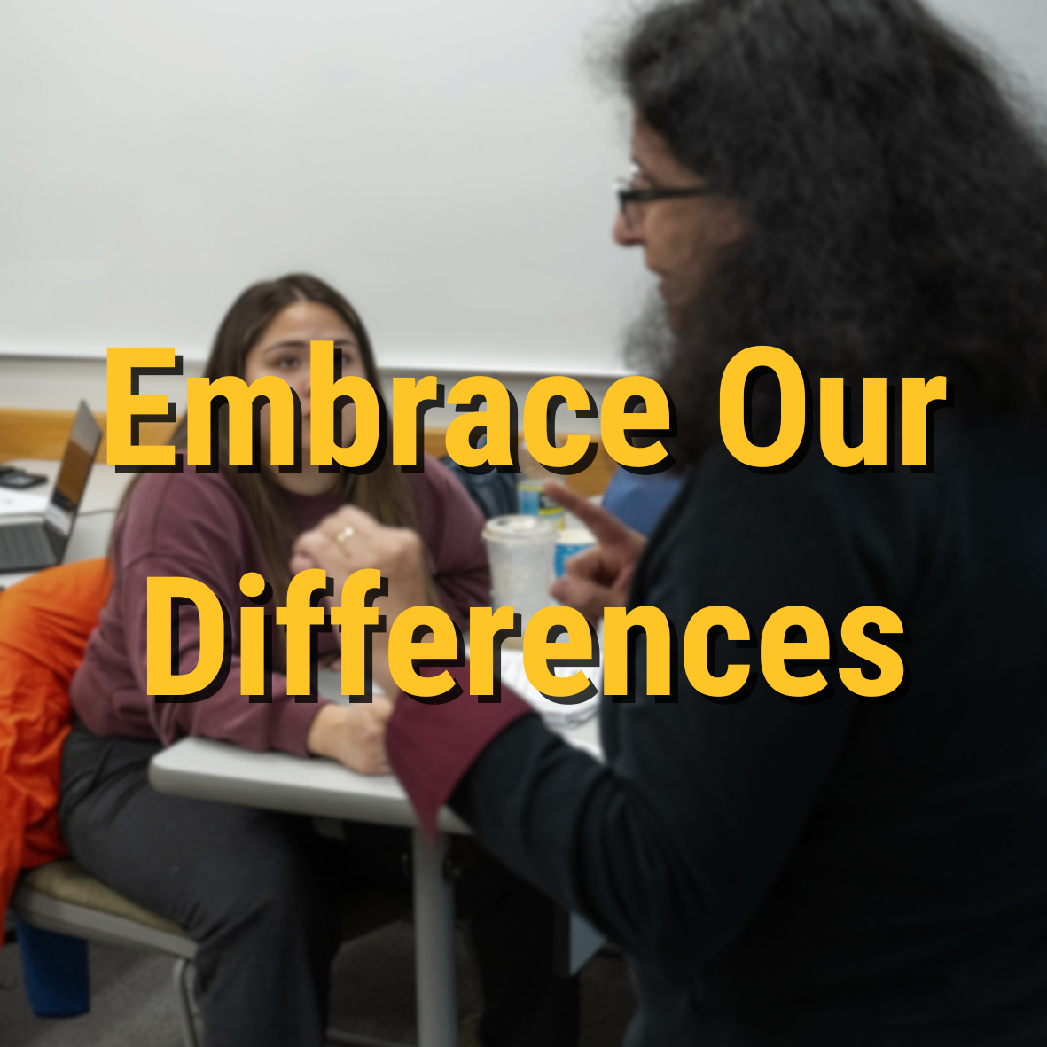 Embrace Our Differences overlay on photo of professor teaching students in a classroom