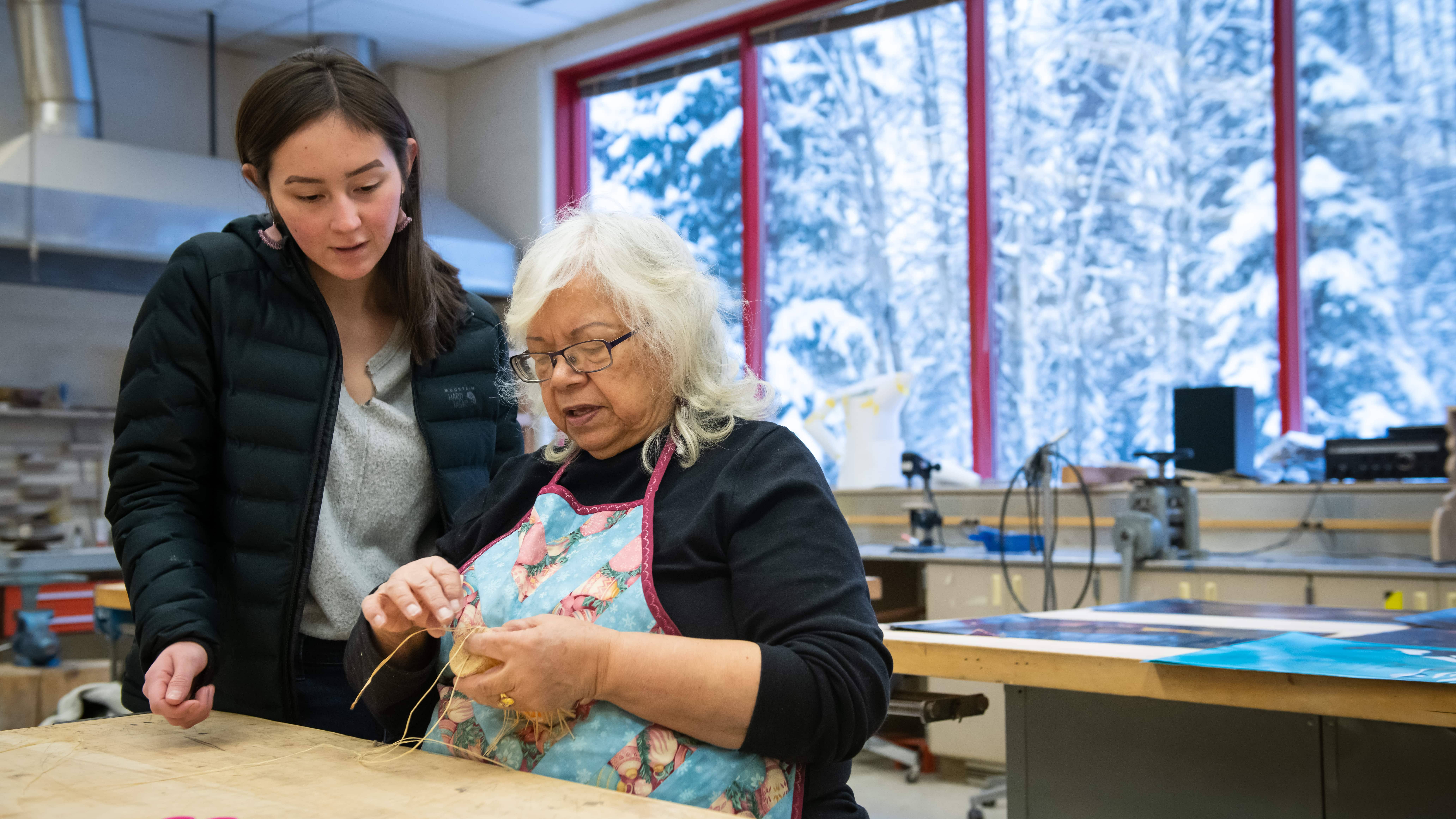 Student learns Alutiiq weaving