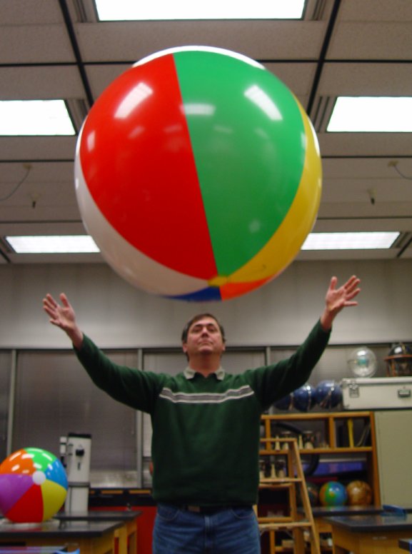 Professor Pantaleone demonstrates the forces acting on a beach ball in flight.