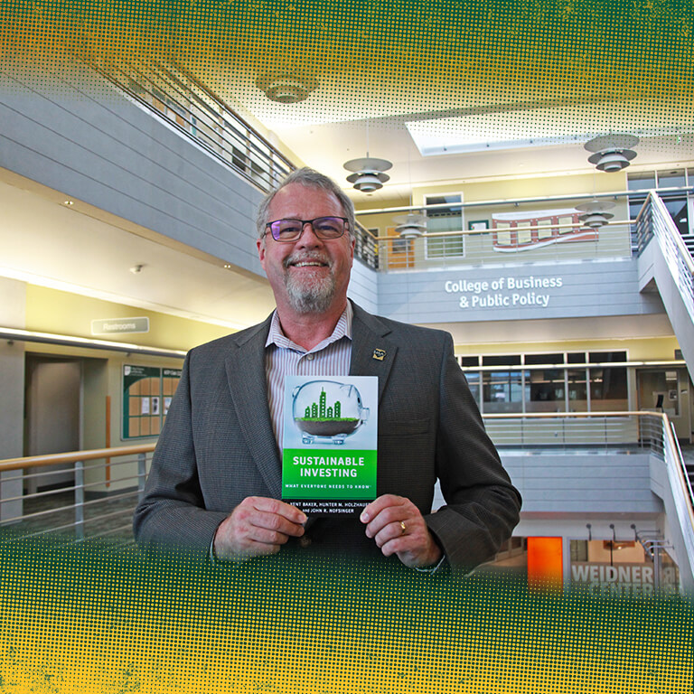 Dr. John Nofsinger with his latest book