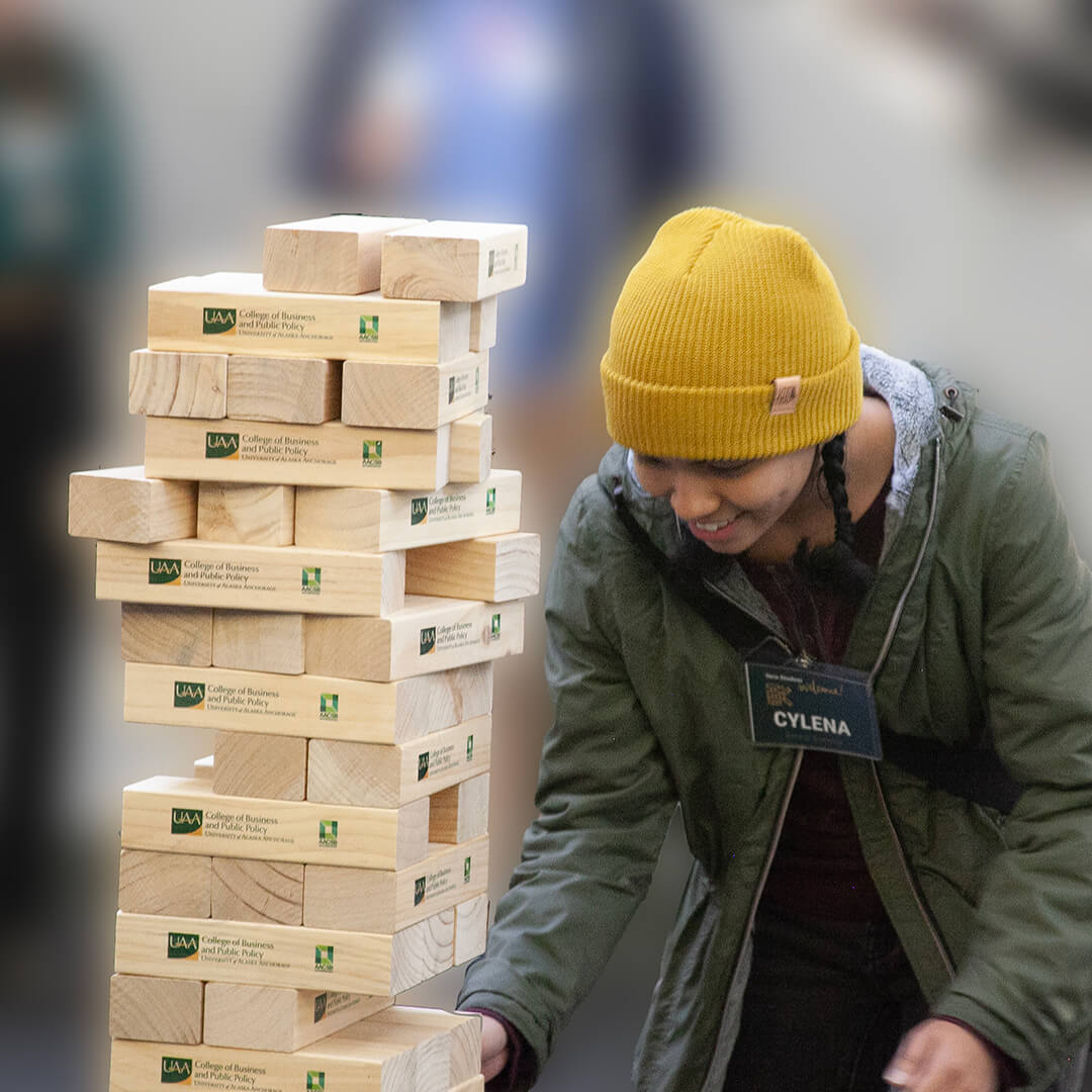 Student plays giant Jenga