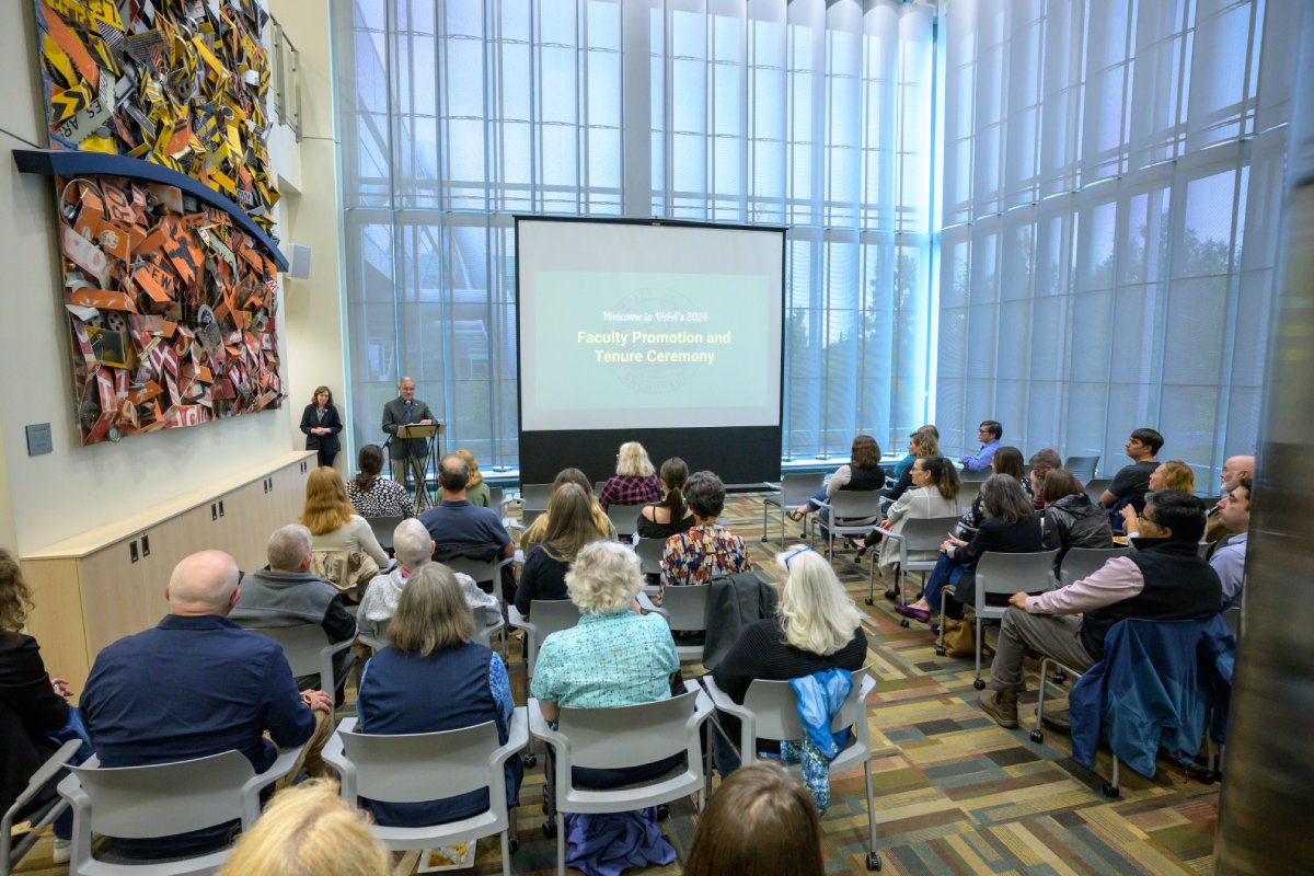 faculty promotion ceremony being held in the solarium