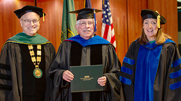 Professor Emeritus Allan Barnes (center)