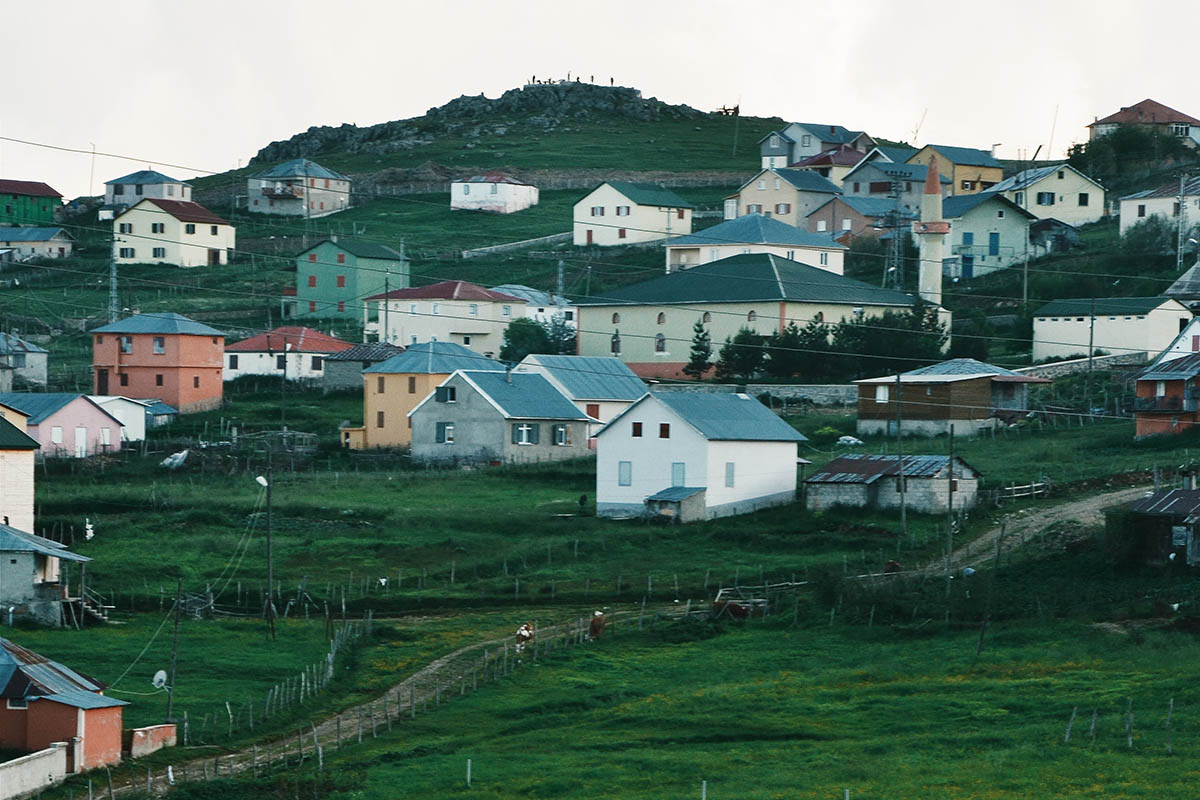 Houses of a rural village on a sloping hill