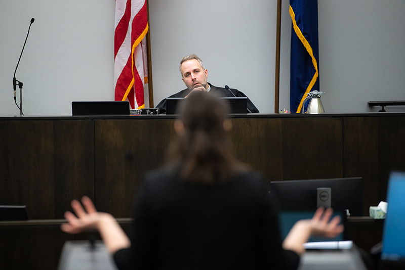 A legal studies student argues a motion in front of a judge