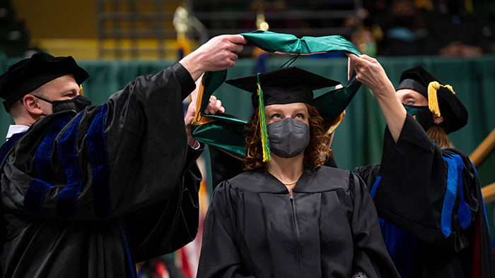 An MPH graduate during a UAA hooding ceremony