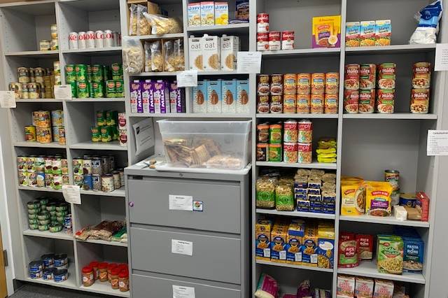 Food pantry shelves stocked with food