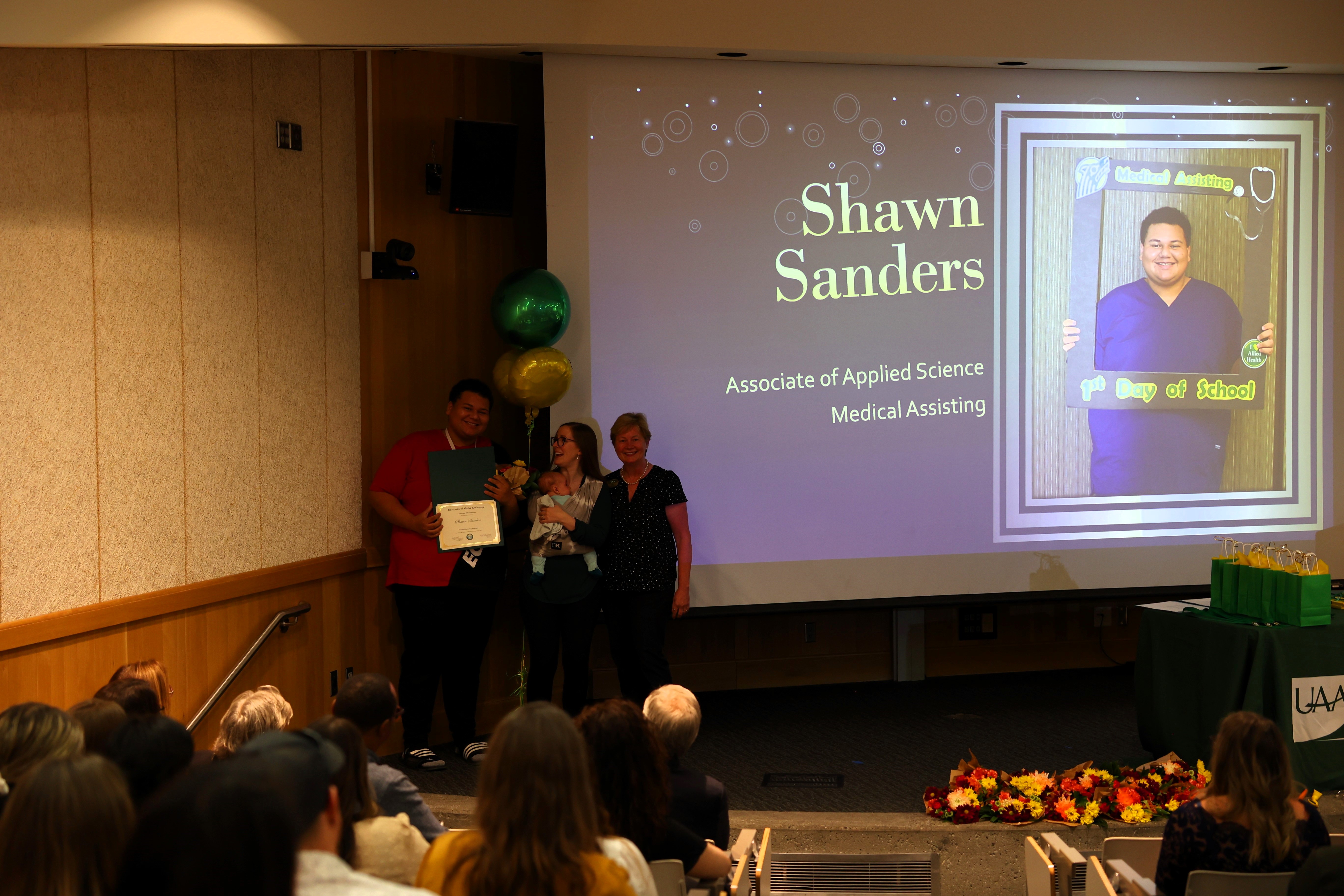 Shawn Sanders holding certificate
