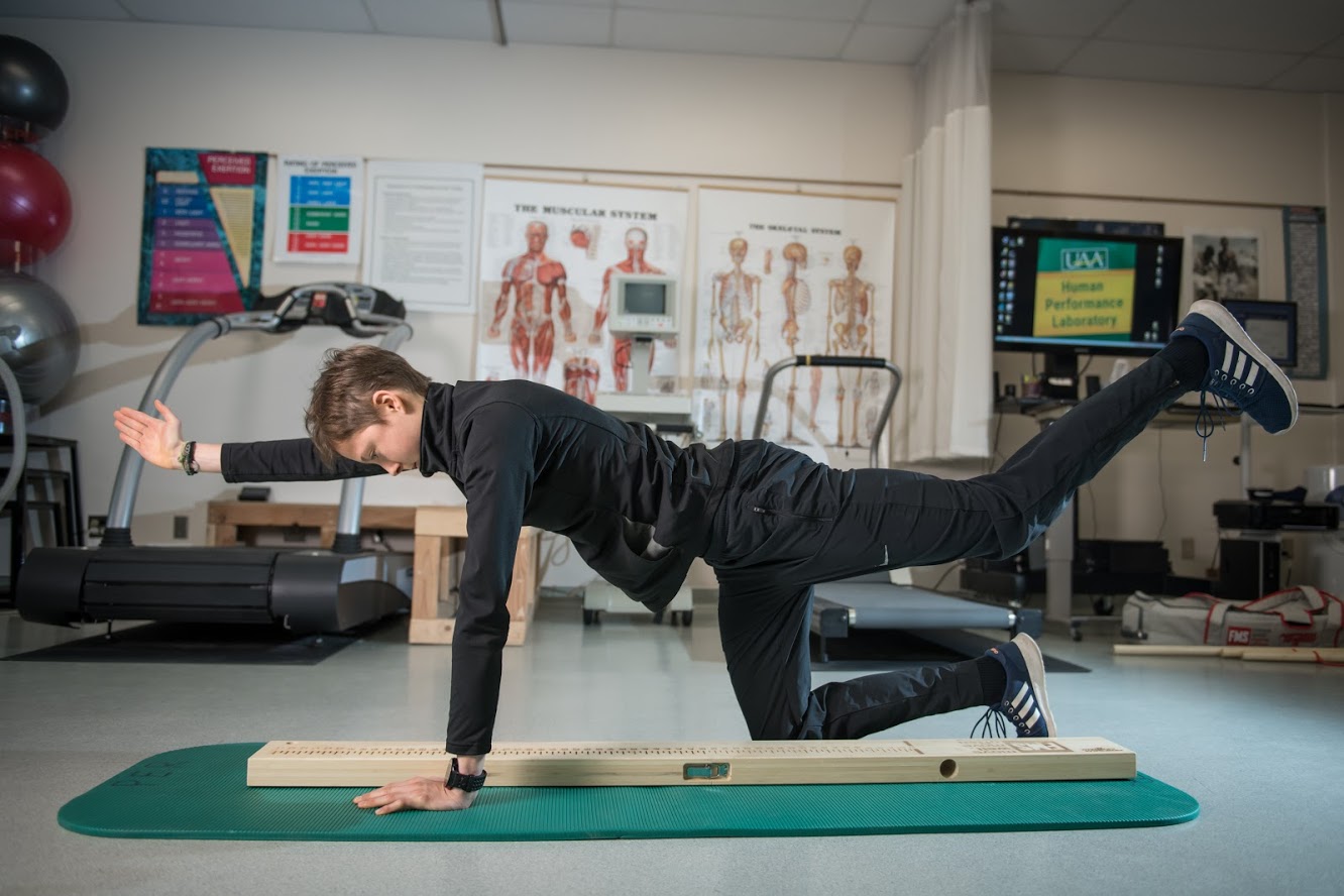 Student performing a fuctional movement screening test