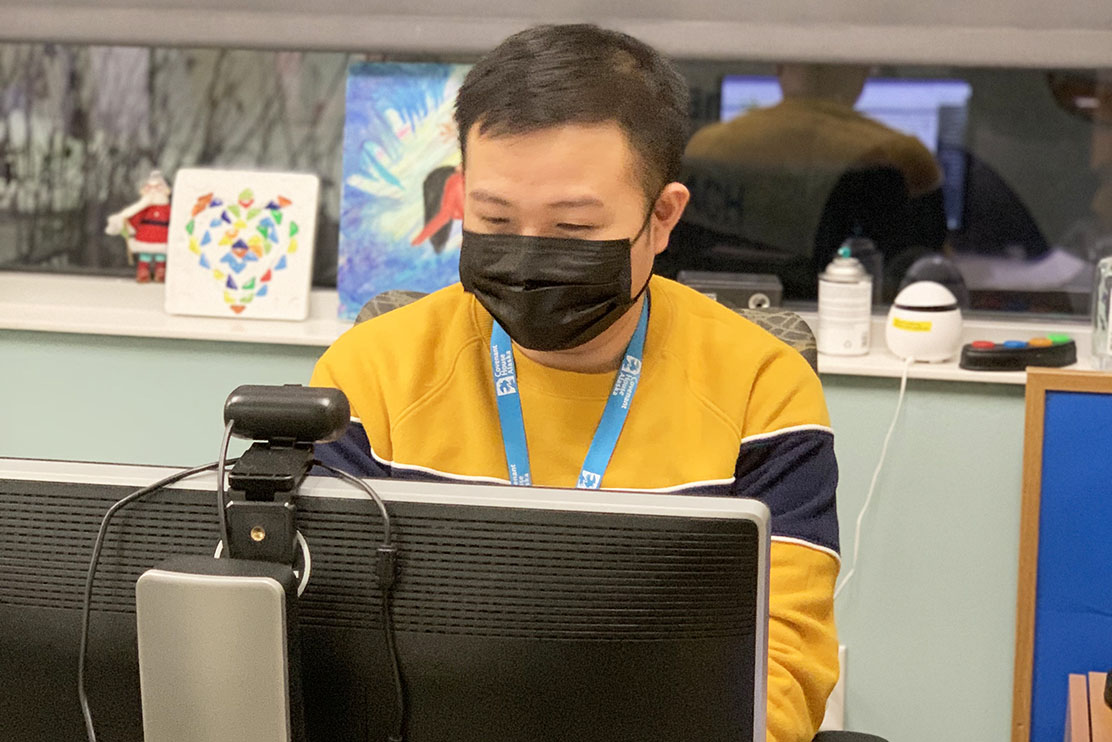 Portrait of Benz Guillermo working at Covenant House Alaska