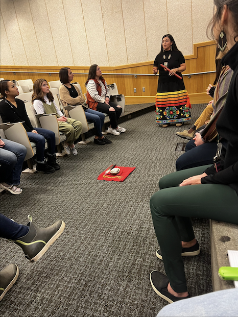 jessica ross speaking to people in chairs