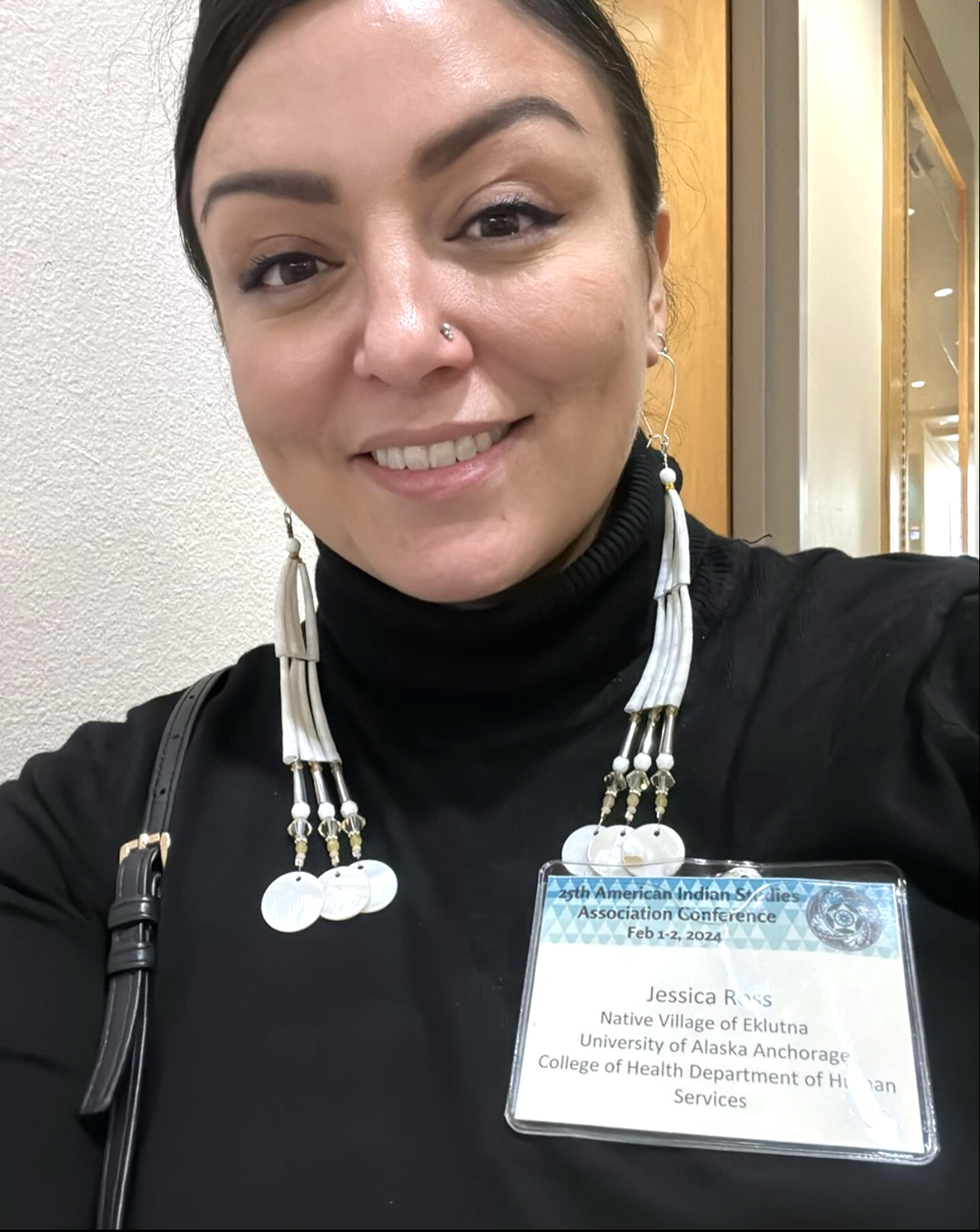 jessica ross smiling wearing name and job title badge
