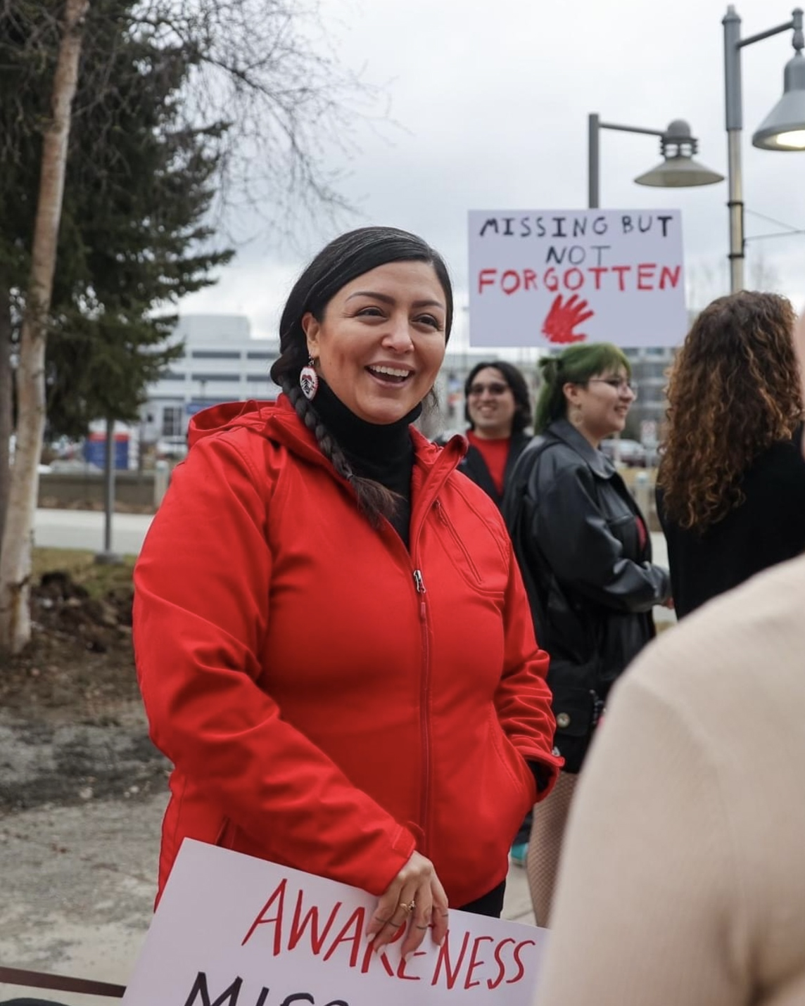 jessica ross smiling at person on sidewalk