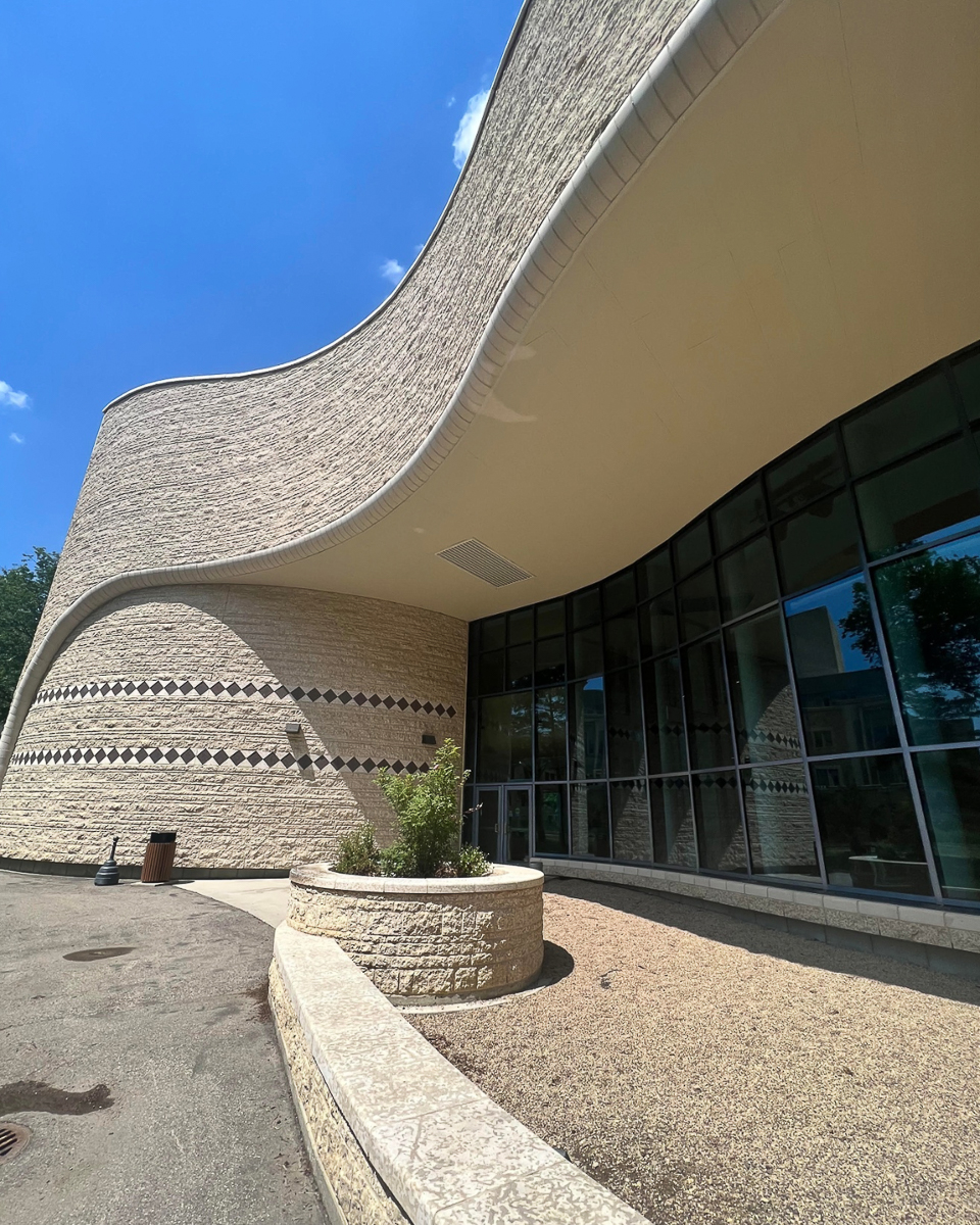 curved wall of outside of brown building