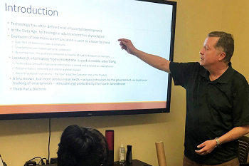 Mark Turberville gestures at a presentation during his internship experience with the Anchorage Municipal Prosecutor's Office