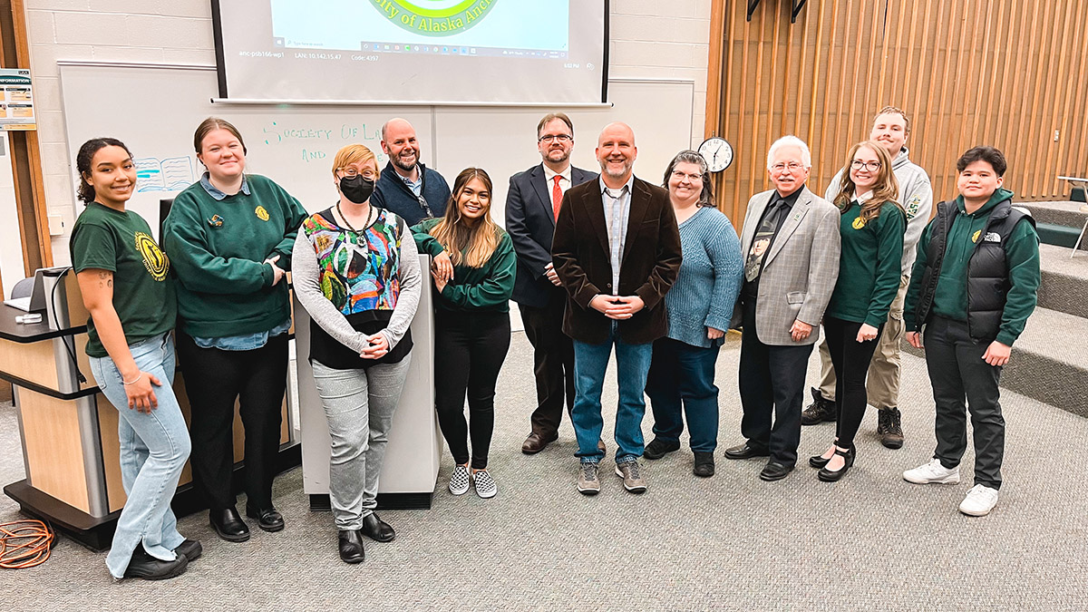 Society of Law & Justice members take a photo with Justice Center faculty members