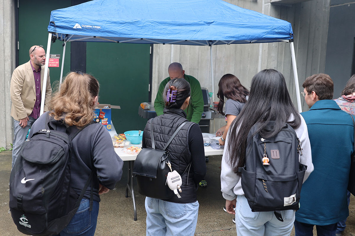 Justice and Legal Studies students come through for some burgers, hotdogs, and snacks during the Return to Campus BBQ event the Justice Center hosted for its returning students on Sept. 8, 2022, at the Professional Studies Building of the University of Alaska Anchorage. (Photo by Ahliil Saitanan/College of Health Dean's Office)