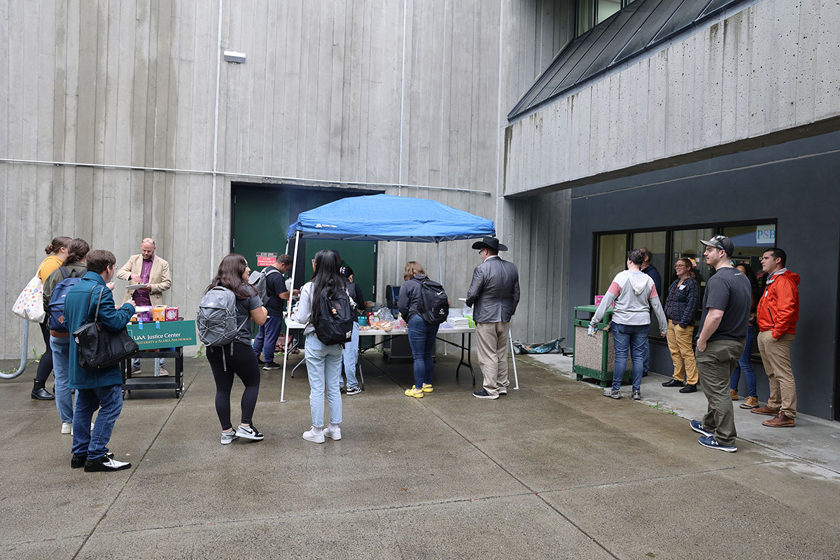 Justice Center faculty, staff, and students enjoy some burgers, hotdogs, and snacks during the Return to Campus BBQ event the Justice Center hosted for its returning students on Sept. 8, 2022, at the Professional Studies Building of the University of Alaska Anchorage. (Photo by Ahliil Saitanan/College of Health Dean's Office)