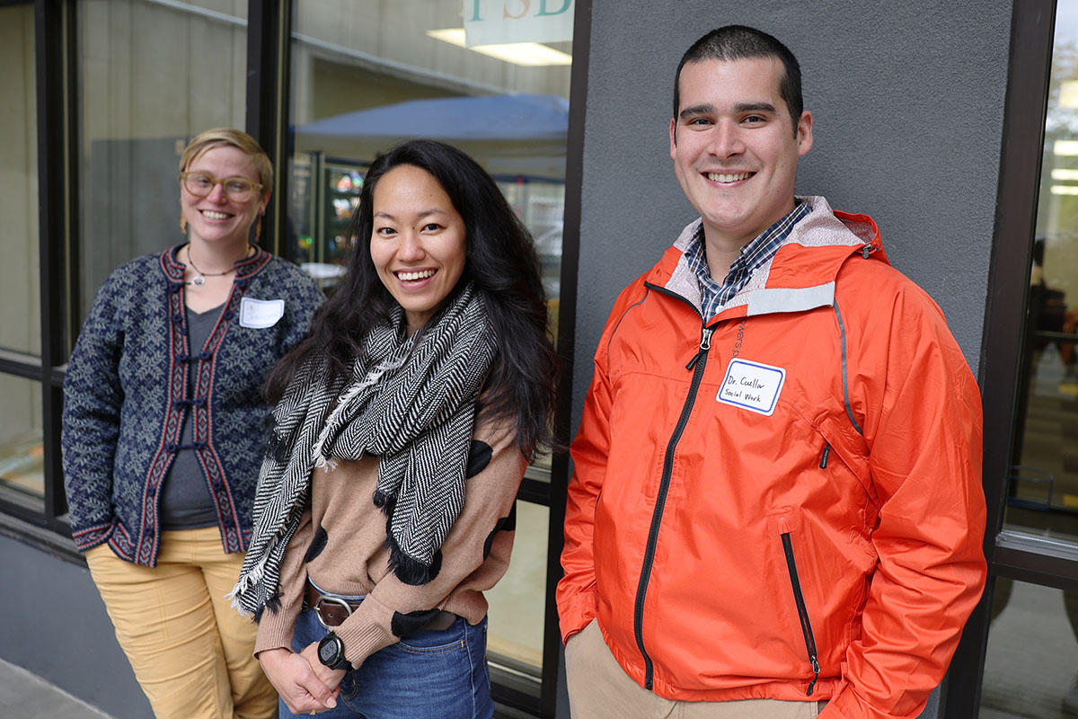Ingrid Johnson, left, Justice Center assistant professor, and School of Social Work assistant professors Rei Shimizu, center, and Matthew Cuellar enjoy burgers, hotdogs, and snacks during the Return to Campus BBQ event the Justice Center hosted for its returning students on Sept. 8, 2022, at the Professional Studies Building of the University of Alaska Anchorage. (Photo by Ahliil Saitanan/College of Health Dean's Office)
