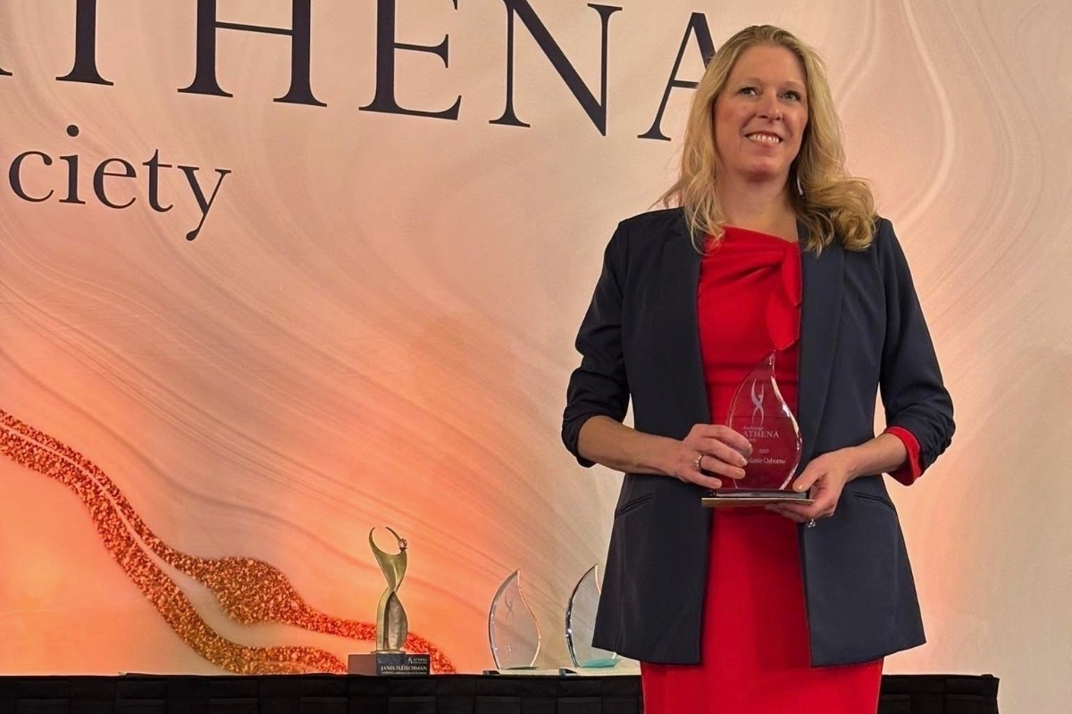 UAA alum Melanie Osborne receiving her Anchorage ATHENA Society award