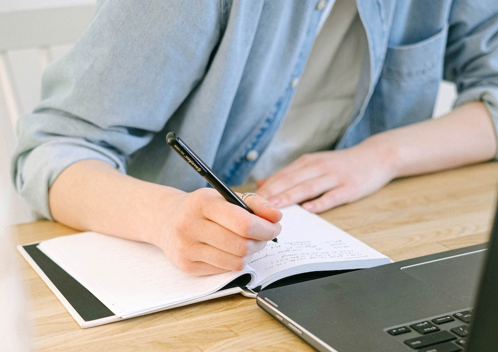 person studying with computer