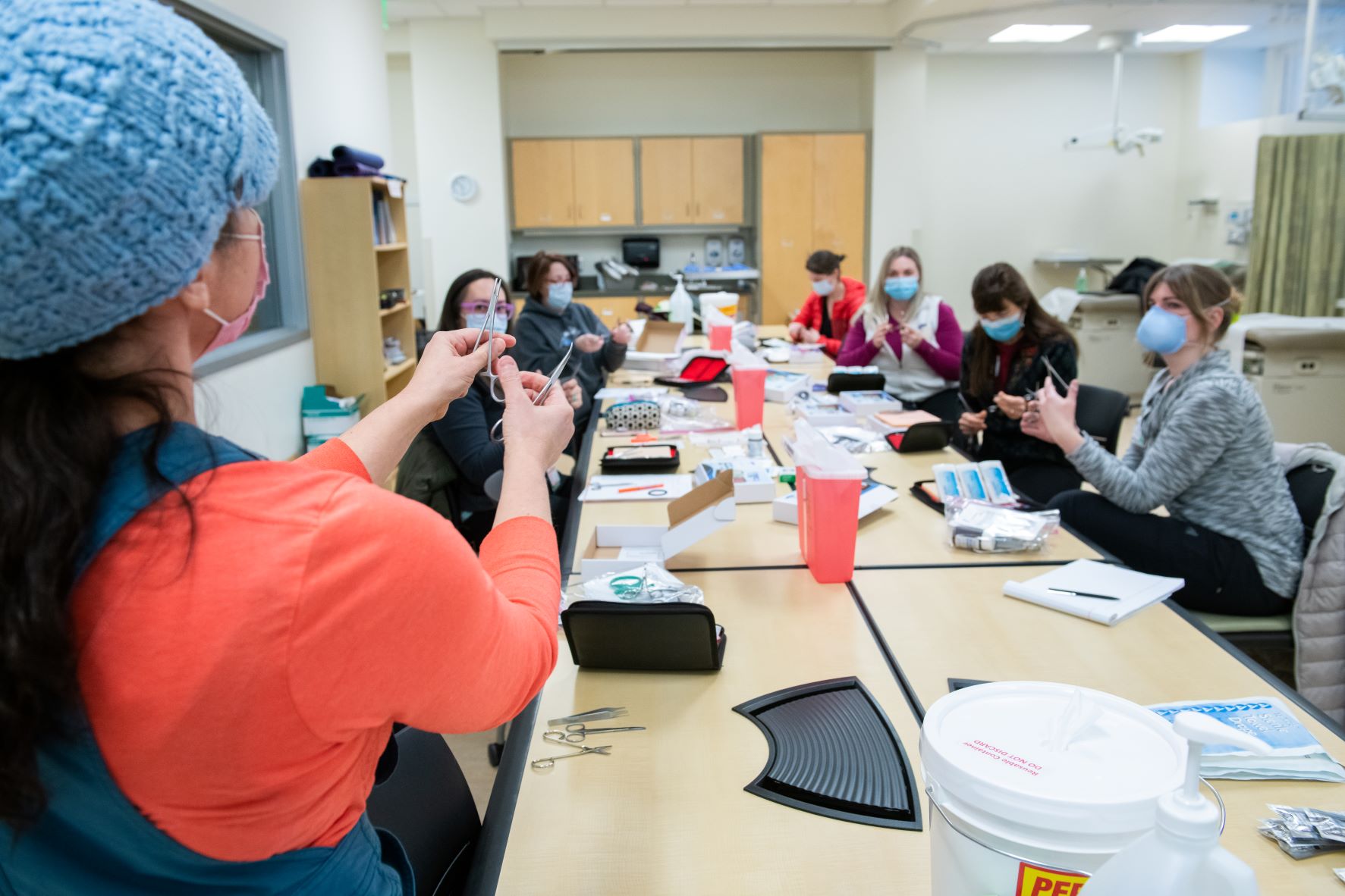 Graduate nursing students in a suture lab class