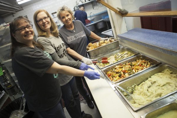 People serving food at Anchorage Gospel Rescue Mission