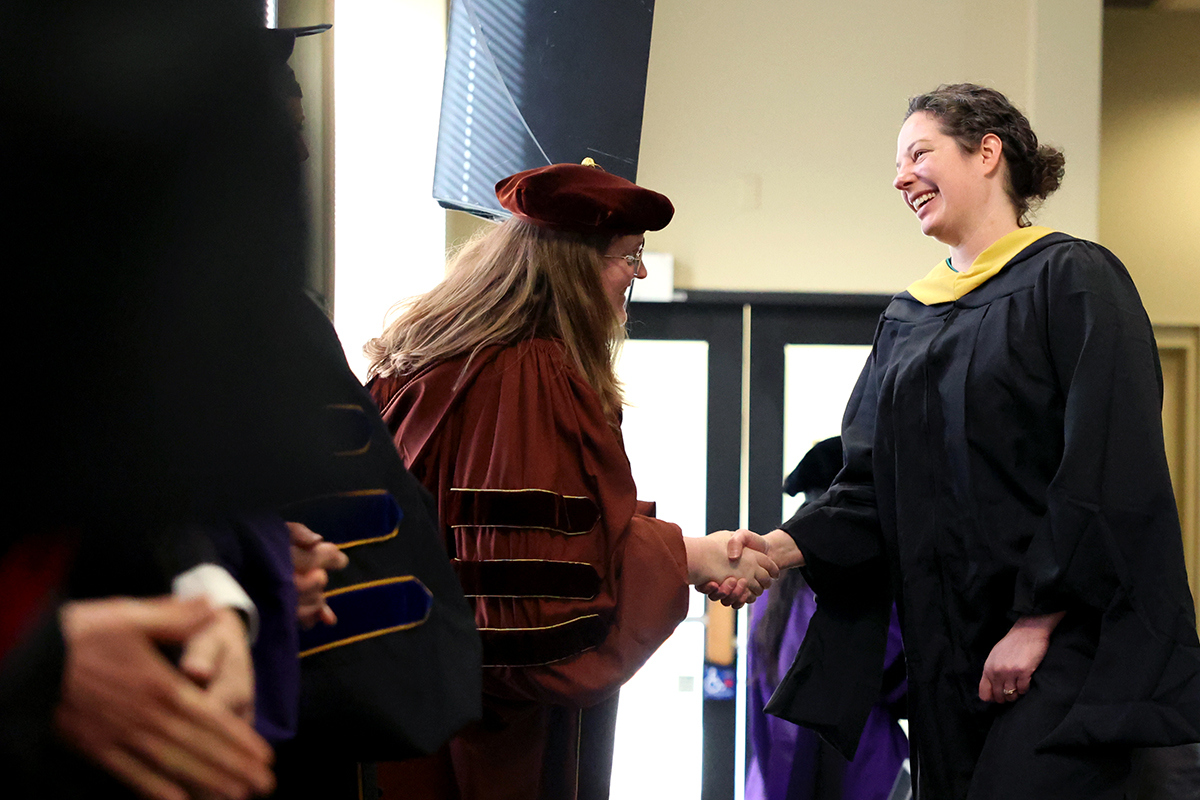 Rebecca Ames shaking professors hand 