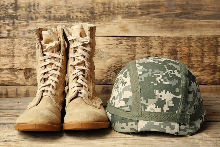 military boots and helmet on floor
