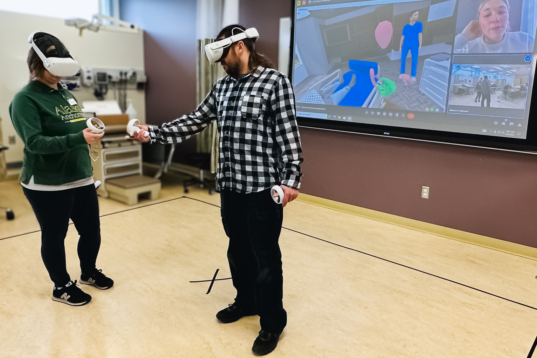 two people wearing virtual reality goggles in front of projector