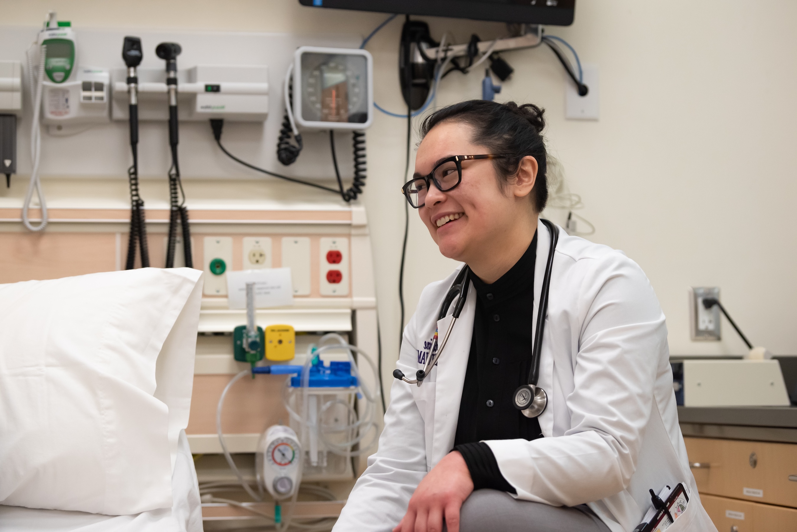 A student in a white coat