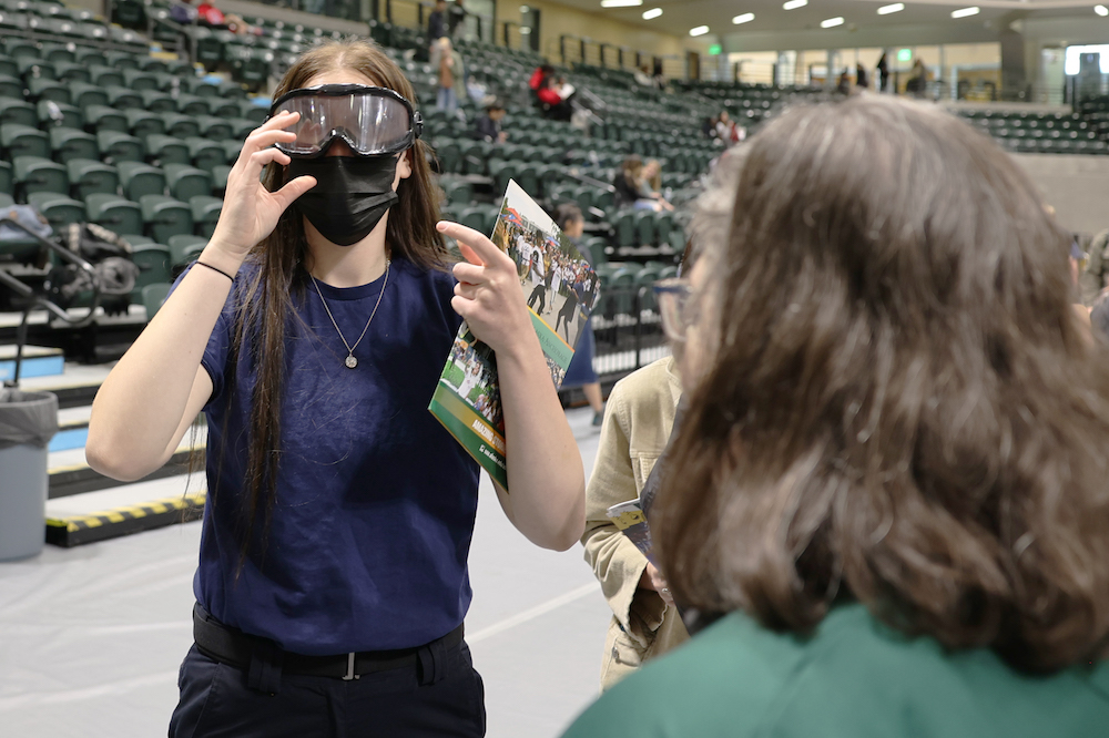a student wearing drunk simulation goggles