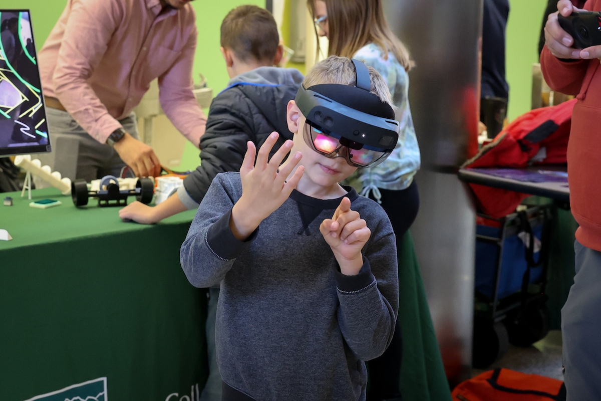 A child wearing virtual reality goggles