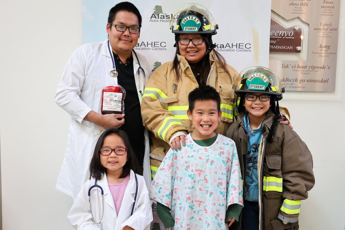 STEM day family dressed as health care professionals