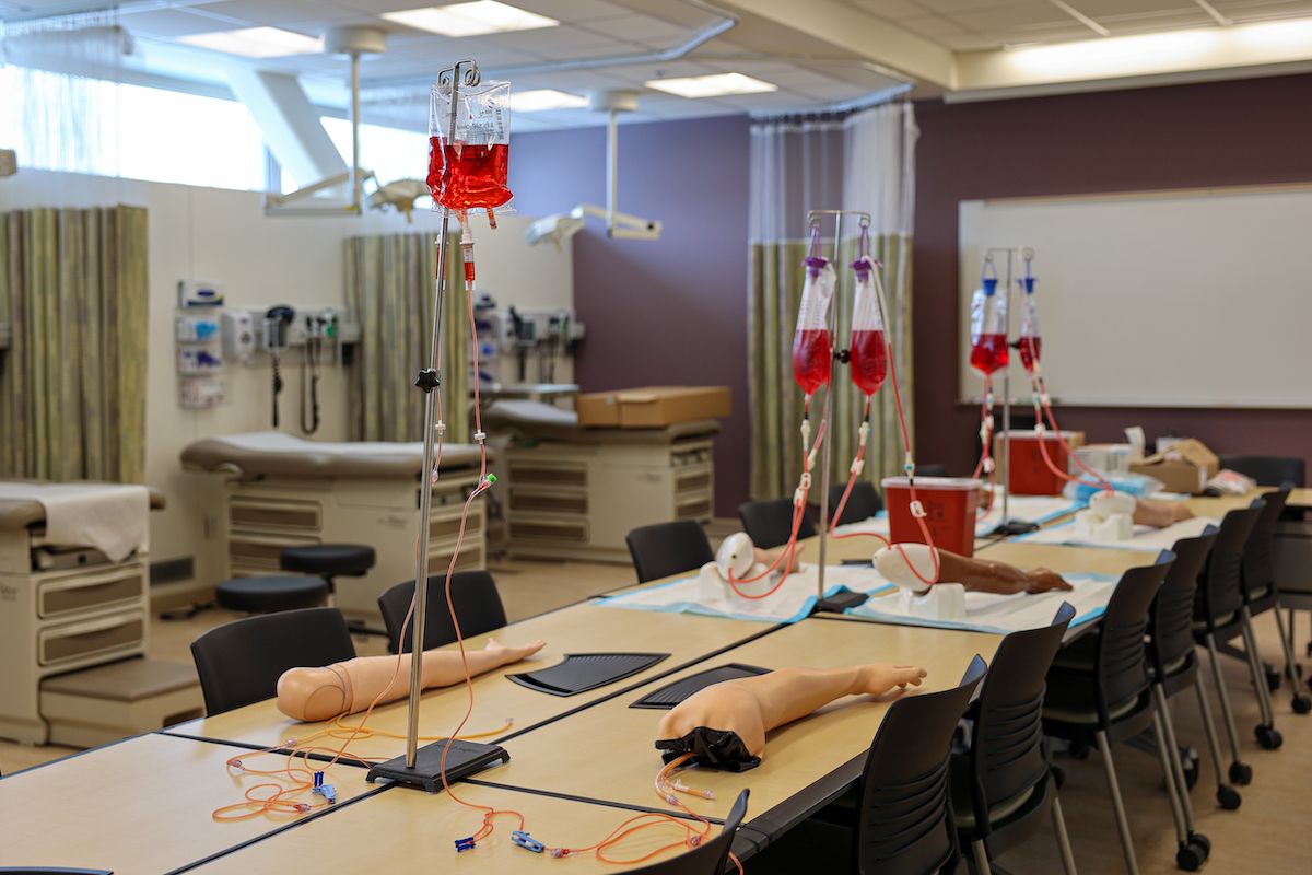 IV manikin arms set up along tables in the skills lab